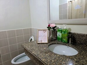 Shower, bidet, towels, soap