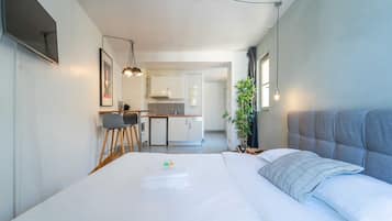 Apartment | Laptop workspace, iron/ironing board, bed sheets