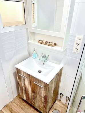 Shower, hair dryer, towels, soap