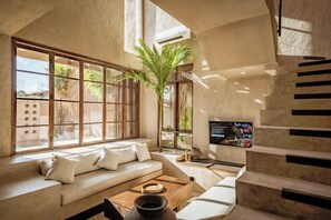 Junior Villa, Patio, Pool View | Living area | 55-inch flat-screen TV with cable channels - Villa Ubuntu at Bocoa Villas (Canggu)