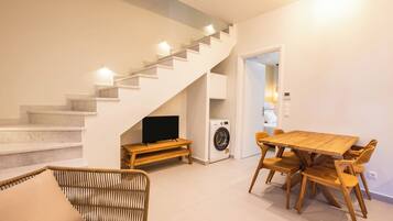 Superior Apartment, City View | Living area | Flat-screen TV