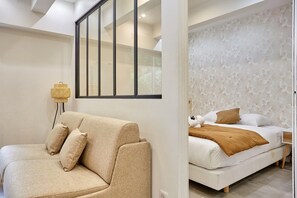 Apartment | Laptop workspace, iron/ironing board, bed sheets