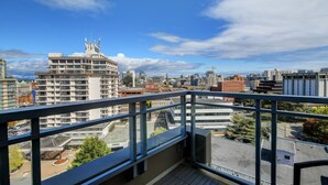 A high-rise building with a modern design, featuring multiple balconies and a clear view of the surrounding cityscape. - High-Rise Loft & Panoramic Harbour Views (Victoria Central British Columbia Provincial Government)