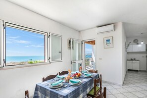 Family Apartment, 2 Bedrooms, Balcony (Porto Relax Apartment 2 With Sea View) | Dining - Porto Relax Apartments (Santa Cesarea Terme)