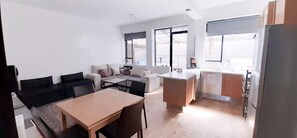 Comfort Apartment, 1 King Bed, Patio | Living area | Flat-screen TV