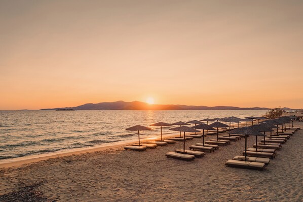 On the beach, sun-loungers