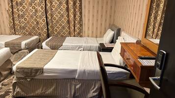 Habitación familiar | 1 dormitorio y tabla de planchar con plancha