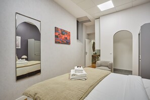 Apartment | Laptop workspace, iron/ironing board, bed sheets