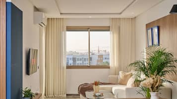Comfort Apartment | Living area | Flat-screen TV