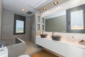 Shower, eco-friendly toiletries, hair dryer, towels