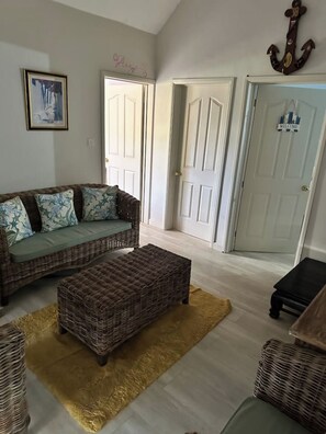 Living area -  Enjoy stunning views of the Benitier Island &Le Morne Brabant from the balcony. (La Gaulette)