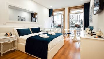 Estudio Deluxe, vista a la ciudad | Cunas, wifi gratis y ropa de cama