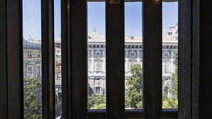 A view through a window with a building in the background. - Garibaldi Attic by Wonderful Italy (Genova)