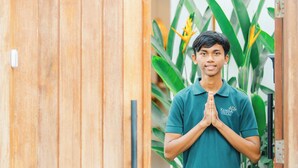 A person standing in front of a wooden door with a plant in the background. - 2BR Villa Seminyak with Pool (Seminyak, Badung Regency)