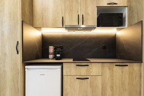 Fridge, microwave, stovetop, coffee/tea maker