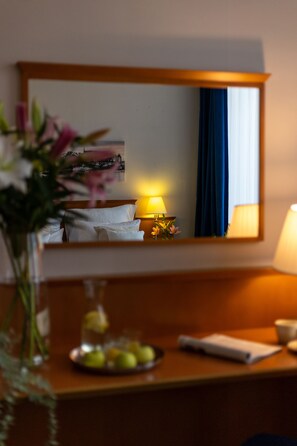 Desk, laptop workspace, blackout drapes, iron/ironing board