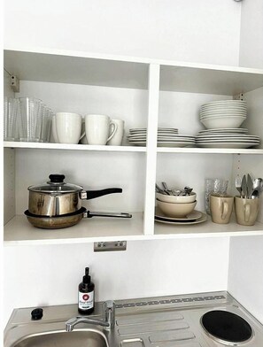 Fridge, microwave, stovetop, cookware/dishes/utensils