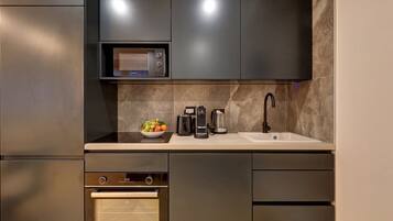 Fridge, microwave, stovetop, coffee/tea maker