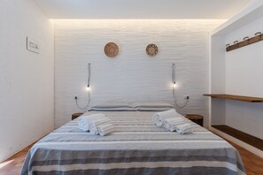 2 slaapkamers, een strijkplank/strijkijzer, beddengoed