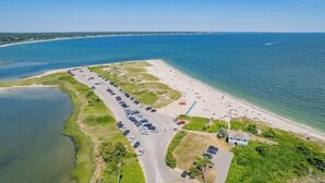 An aerial view of a beach with a parking lot and a small building. - Luxury rental with pool. Close to village and beach RPMS157 (Osterville)