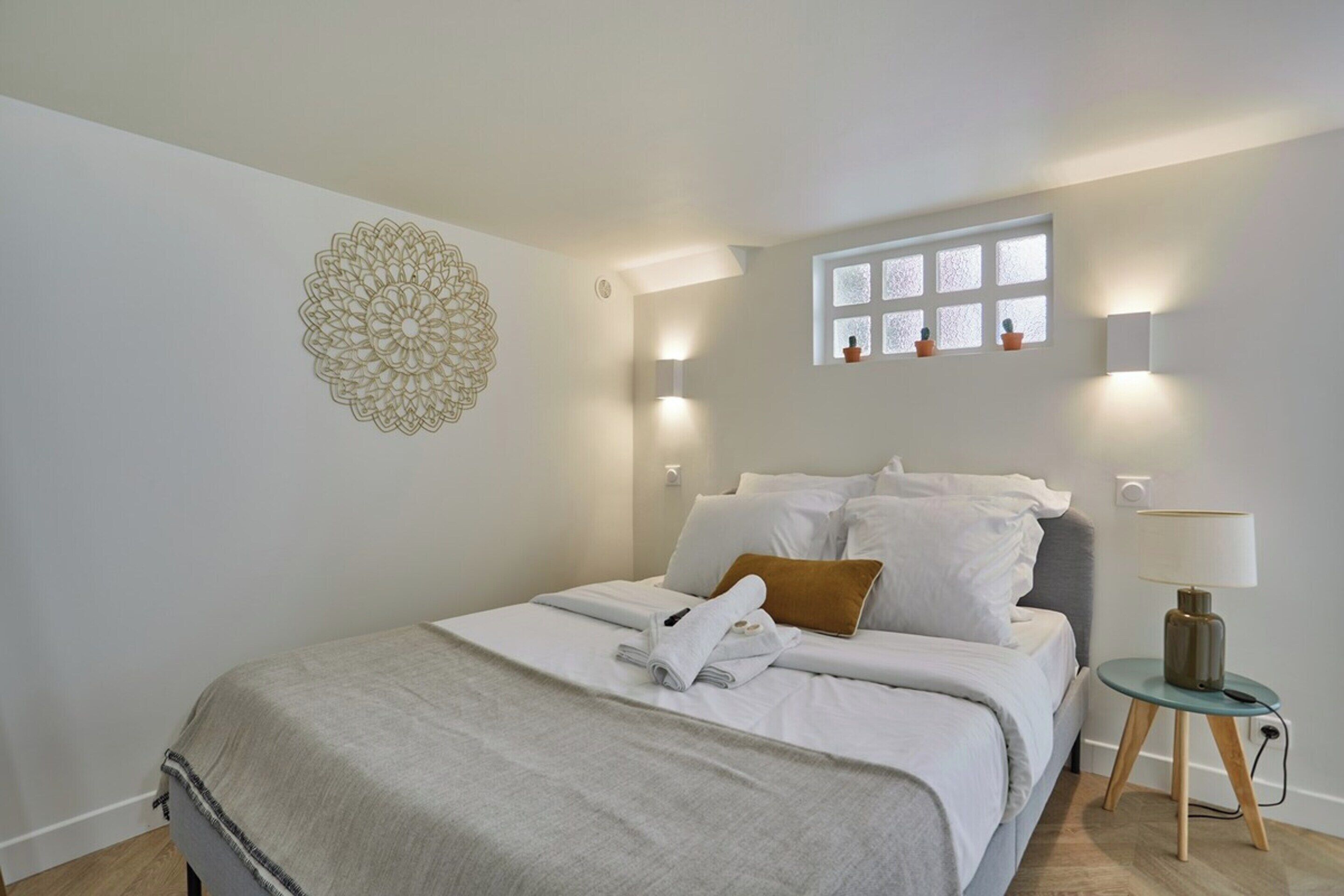 Laptop workspace, iron/ironing board, bed sheets