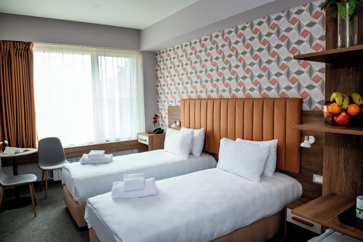 Double or Twin Room, Mobility Accessible | 1 bedroom, in-room safe, blackout curtains, iron/ironing board