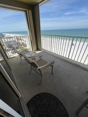 A balcony with a view of the beach and ocean. - Holiday Villas III- 602 in Indian Shores-2 bedroom condo Low rates all 2026! (Indian Shores)