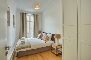 Apartment | Laptop workspace, iron/ironing board, bed sheets