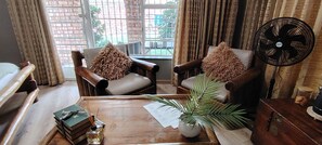 Room, 1 Bedroom, Smoking, Balcony | Living room | Books - Room-indulgent Escape, Jet Bath, Stunnin (Johannesburg)