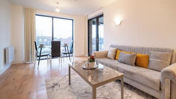 Deluxe Apartment, 2 Bedrooms (With Balcony) | Living area | TV