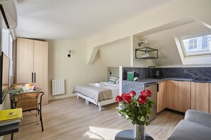 Apartment | Laptop workspace, iron/ironing board, bed sheets