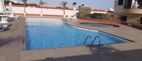 Outdoor pool, open 10:00 AM to 8:00 PM, pool umbrellas, sun loungers