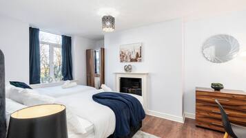 1 bedroom, desk, iron/ironing board, travel crib