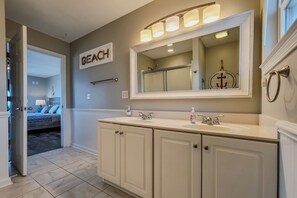 Enjoy a refreshing bathroom experience with a double sink and large mirror.