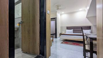 Deluxe Room, City View | Select Comfort beds, laptop workspace, free WiFi, bed sheets
