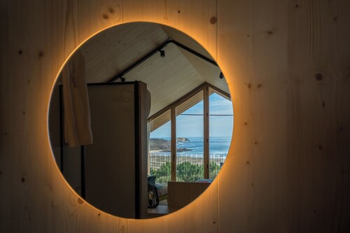 Wooden duplex cabin with panoramic sea views. 