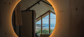 Wooden duplex cabin with panoramic sea views. 