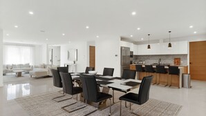 A modern apartment with a dining area, kitchen, and living space. - Inlet Paradise in Rhyll (Rhyll)