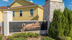 A building with a sign that reads "Summerville Resort".