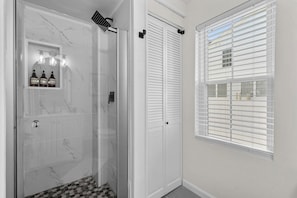 Shower, hair dryer, towels, soap