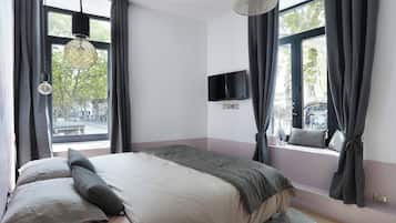 Apartment | Laptop workspace, iron/ironing board, bed sheets