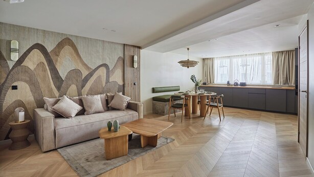 A modern living room with a sofa, coffee table, and a dining area with chairs and a table. - Spacious AC Flat Luxembourg St Germain des Pres (Paris)
