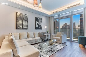 Luxury Apartment, 2 Bedrooms | Living room | 55-inch flat-screen TV with digital channels