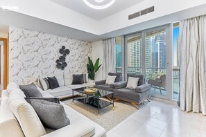 Premium Apartment, 4 Bedrooms | Living room | 55-inch flat-screen TV with cable channels - bnbme | Damac Waves Tower | 3 + Maids (Dubai)