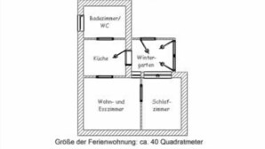 A floor plan of a residential property with a kitchen, bathroom, living room, and bedroom. - House Strandkorb apartment Strandkob 6 (Bensersiel)