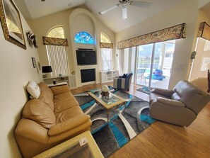 House, Multiple Beds, Pool Access, Pool View (Cozy Canal) | Living area | 42-inch flat-screen TV with digital channels, fireplace - Cozy Canal (Palm Coast)