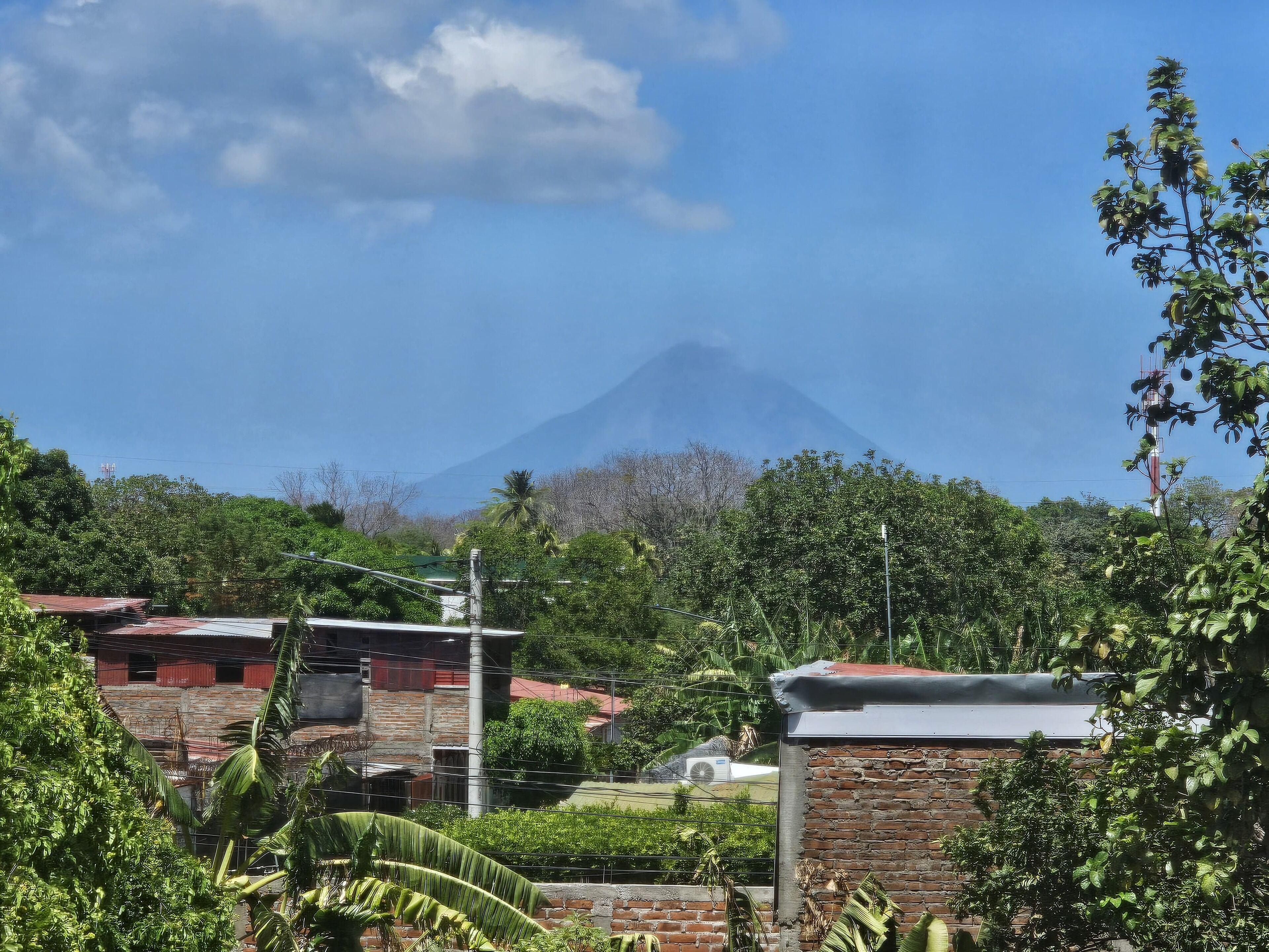 A residential area with a mountain in the background.