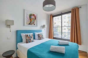 Apartment | Laptop workspace, iron/ironing board, bed sheets