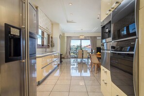 Deluxe Villa, Garden View | Private kitchen | Full-size fridge, espresso maker, coffee/tea maker, electric kettle