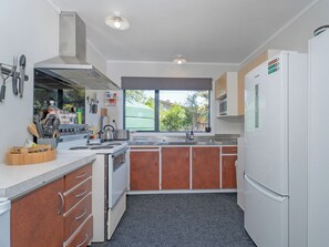 Fridge, microwave, coffee/tea maker, toaster - The Bach at 44 - Cooks Beach Holiday Home (Cooks Beach)
